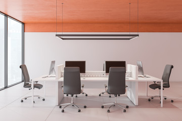 Modern open space office with orange ceiling