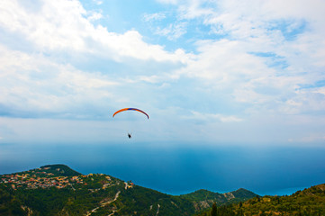 Paragliding in the sky. Extreme sport. Rachi village. Lefkada. Greece.