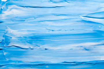 Blue and white acrylic paint abstract art background. Plaster wall design surface.