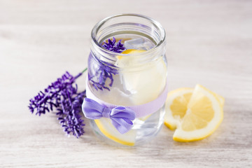 Lavender lemonade drink on white wooden table