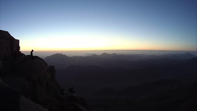 Climbing the mountain of Moses, a beautiful sunrise in the mountains of Egypt in the Sinai Peninsula, timelapse