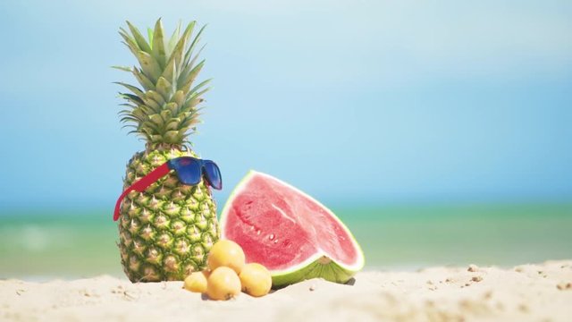Tropical summer mix fruits with sea background.