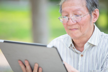 Older man use tablet