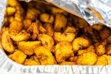 Diced Nigerian Plantain in Aluminum container served at Nigerian Party © primestockphotograpy