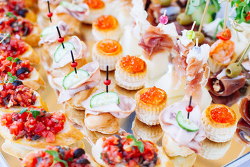 Beautifully decorated catering banquet with different food snacks and appetizers