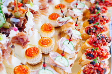 Beautifully decorated catering banquet with different food snacks and appetizers