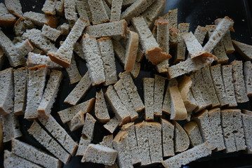 Smooth, sliced ​​pieces of gray bread for making spicy fried crackers. Natural nutrition, healthy foods for good health.