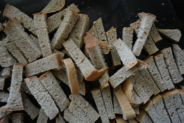 Smooth, sliced ​​pieces of gray bread for making spicy fried crackers. Natural nutrition, healthy foods for good health.