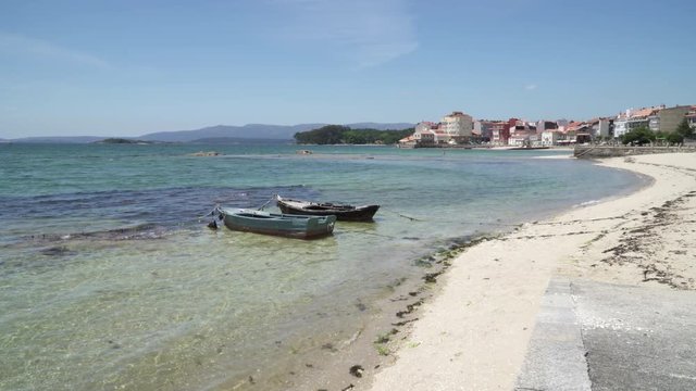 Small boats called Chalana anchored on the beach. Rias Baixas seascape, Carril, Galicia, Spain