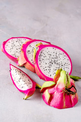 Fresh Organic Pitahaya Dragon Fruit Cut in Halves on Gray Background Tasty Tropical Fruit Copy Space