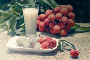 Fresh juicy lychee fruit on a glass plate. Organic leechee sweet fruit with litchy juice. Organic lychee fruit concept. Exotic tropical litschi berry. Peeled lychee fruit. Advertising with lychee.