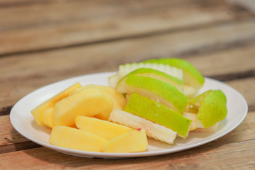slices of melon on wooden table