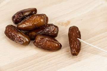 dry dates on a light wooden floor
