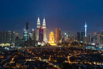 Poster Kuala lumpur cityscape. Panoramic view of Kuala Lumpur city skyline during sunrise viewing skyscrapers building and Petronas twin tower in Malaysia. © ake1150