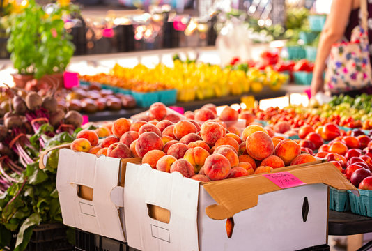 Boxes Of Fresh Yellow Peaches At A Community Market