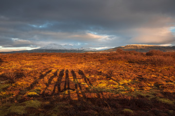 Landscape in Iceland waterfall sun mountains light golden hour road