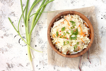 Traditional sauerkraut with carrots and green onions
