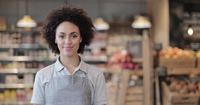 Portrait of grocery sales assistant looking to camera
