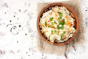 Traditional sauerkraut with carrots and green onions