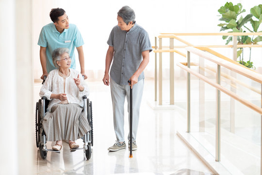 Nursing assistant taking care of senior woman