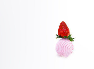 Big red strawberry on pink marshmallow on white background