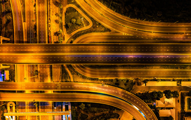 Aerial view Expressway motorway highway circus intersection at Night time Top view , Road traffic in city at thailand.