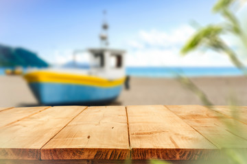 Desk of free space and blurred background of beach 