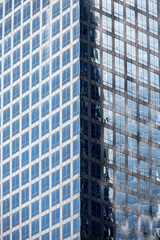 Fototapeta premium Architectural background of glass skyscraper taken in New York City.