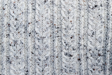 Abstract textured background of close up detail of knitting in a handmade sweater