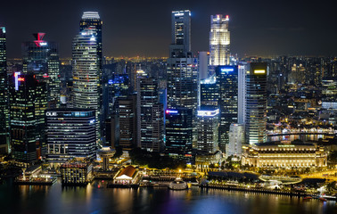 Fototapeta na wymiar Night cityscape of Singapore. Skyscrapers at night. Business part of Singapore city at night.
