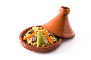 Traditional tajine with vegetables, chickpeas, meat and couscous isolated on white background