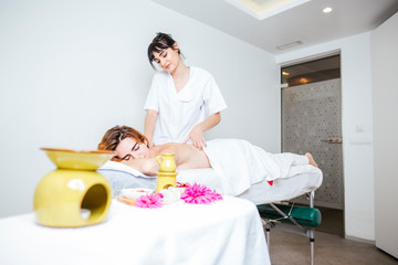 attractive woman getting a relaxing massage at a home spa