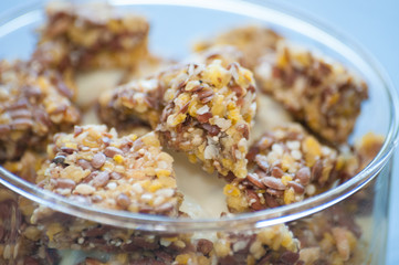 Granola with Greek yogurt in a glass beaker, close-up macro. Healthy and natural food, delicious breakfast.