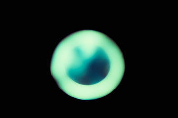 Ray of lamp spot light over black background, square stage abstract illumination