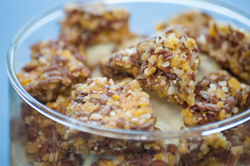 Granola with Greek yogurt in a glass beaker, close-up macro. Healthy and natural food, delicious breakfast.