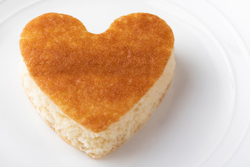 Heart shape confection on white plate