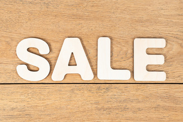 word sale of wooden letters on table