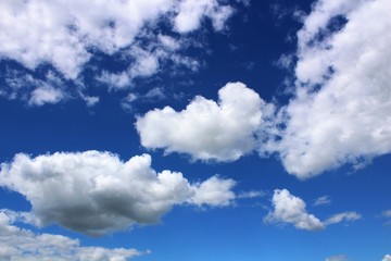 Naklejka na ściany i meble White clouds in azure blue sky