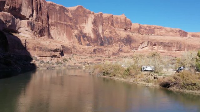 Aerial of campground along Colorado river with RV travel trailers on vacation