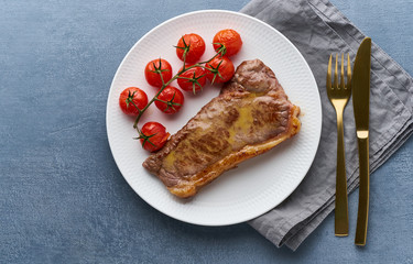 keto ketogenic diet steak with tomatoes on dark background, top view copy space