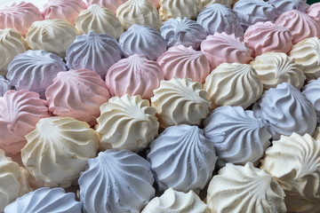 Multicolor fruity zephyr. Closeup of dessert with raspberry, blueberry and banana flavor. Natural product, ready for sale.