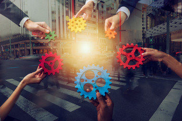 Business team connect pieces of gears. Teamwork, partnership and integration concept. Double...
