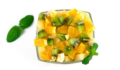 Mixed fruit in white plate isolated on white background .