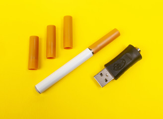 Electronic cigarette on yellow background.