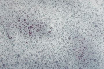 Soap bubbles background- suds liquid