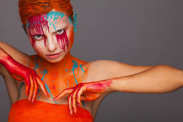 Portrait of a model in an expressive creative style using an unusual make-up