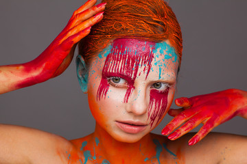 Portrait of a model in an expressive creative style using an unusual make-up