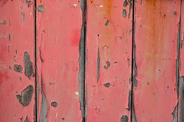 Pink painted worn metal surface