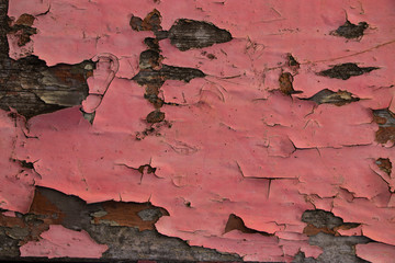 Pink painted worn metal surface