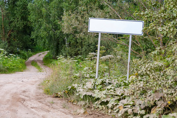 A sign on the road indicating the locality